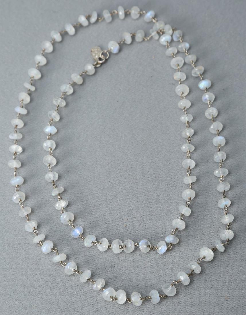 Emily & Ashley Faceted Moonstone Necklace: Lovely necklace by Emily and Ashley. This bead and sterling wire necklace is made of faceted moonstone beads with wire links. The tab at the clasp is marked 925 Emily & Ashley and measures approx 34"