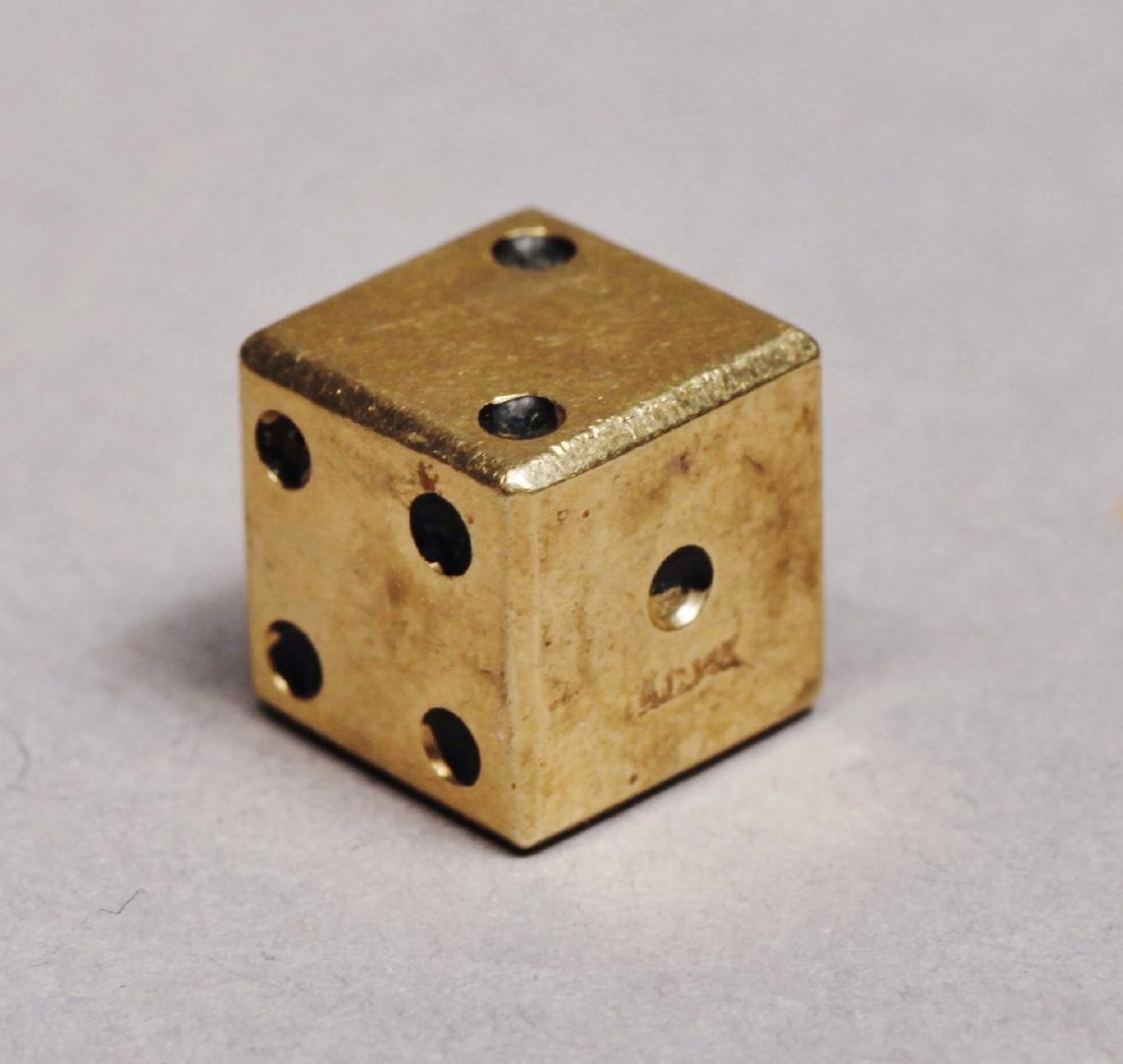 Vintage 14K Gold 1 Dice, Artist Signed: Marked 14 K and the intails A.K. for the company. Measures about 3/8 of an inch. Weight about 4 grams. Has a bit of wear, some of the black wear the numbered dots is a little worn. Looks like the dice