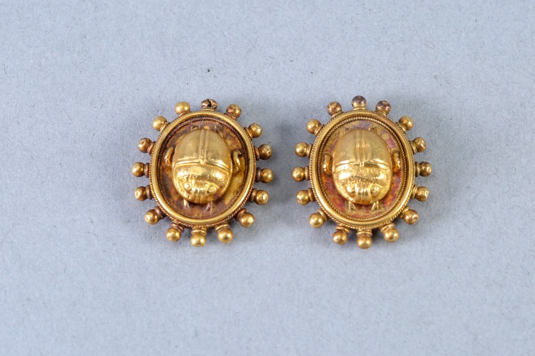 Victorian Egyptain Revival Scarabs 14 K Pair: Victorian Egyptian Revival Scarabs, pair. Unmarked. Tests as 14 k. 10.2 grams. In very good overall condition. They are just under a inch long. the Scarabs beetles are in high relief. The whole piece 