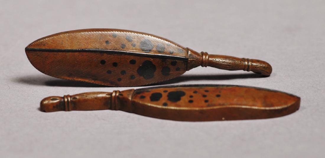 c1830 Kazuhide Ikeda Leaf or Feather Menuki: Amazing pair of feather or leaf bronze menuki. One piece is signed along the edge. These date to the end of the Edo period c1830 and feature fine detailed fronds with long stem "handles" and black spo