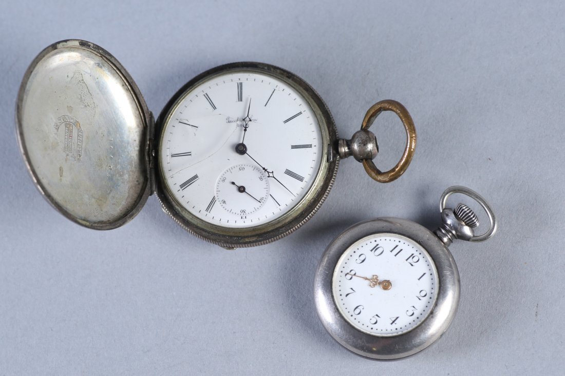 Antique Coin Jacot & Son, NE Watch Co Sterling Pocket W: Antique pocket watch lot with 2 pocket watches. One watch is from Jacot & Sons and is coin silver. It is key wind, inner case is marked Jacot & Sons warranted coin silver Locle and is numbered 62991. 