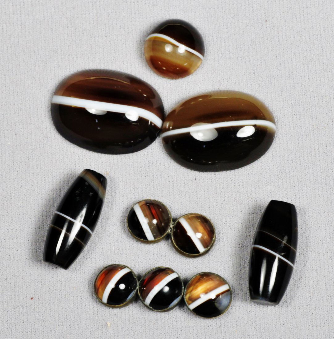Unique Set of Jasper Stones: The 2 larger oval cabachons and the single are carved out on the back. There are 2 elongated beads. 2 sets of cabachons set in groups of 2 and 3 together.
