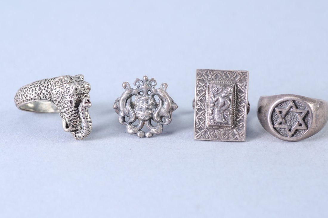 4 Vintage Designer Sterling Rings: Lot of 4 rings, Square Bali dancer approx size 5.25 Star of David Star approx size 10.75, Green Man type of face flanked with angels approx size 6, elephant with large tusk approx size 5.75, some are 