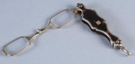 19th Century French Lorgnette: Pretty folding spectacles or lorgnette. Frame of eyeglass is marked P.M. and the boar's head indicating France. Outer case has a bannet shaped cartouche has no monogram. Folds and opens easily. Tests 