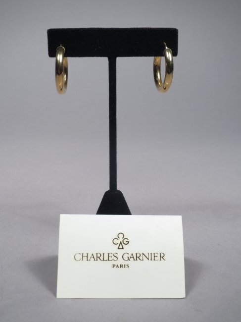 18K Yellow Gold Charles Garnier Hoop Earrings: Simple but elegant pair of Charles Garnier hoop earrings in 18K yellow gold. Each earring post is marked 750 with the right facing eagle and the company maker mark on the earring post. Measure approx