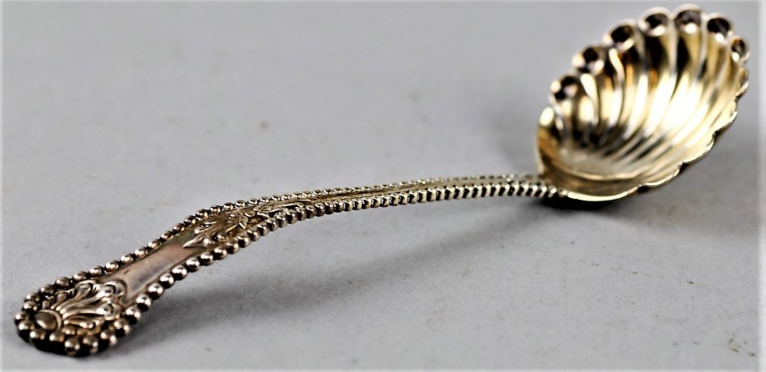 Frank Herschede Scalloped Sterling Spoon Shell: Frank Herschede Scalloped Sterling Spoon. With a shell motif. Has the remains of a slight gold wash. There is some residue on the back of the spoon of either sugar or perhaps salt. Have not tried to c