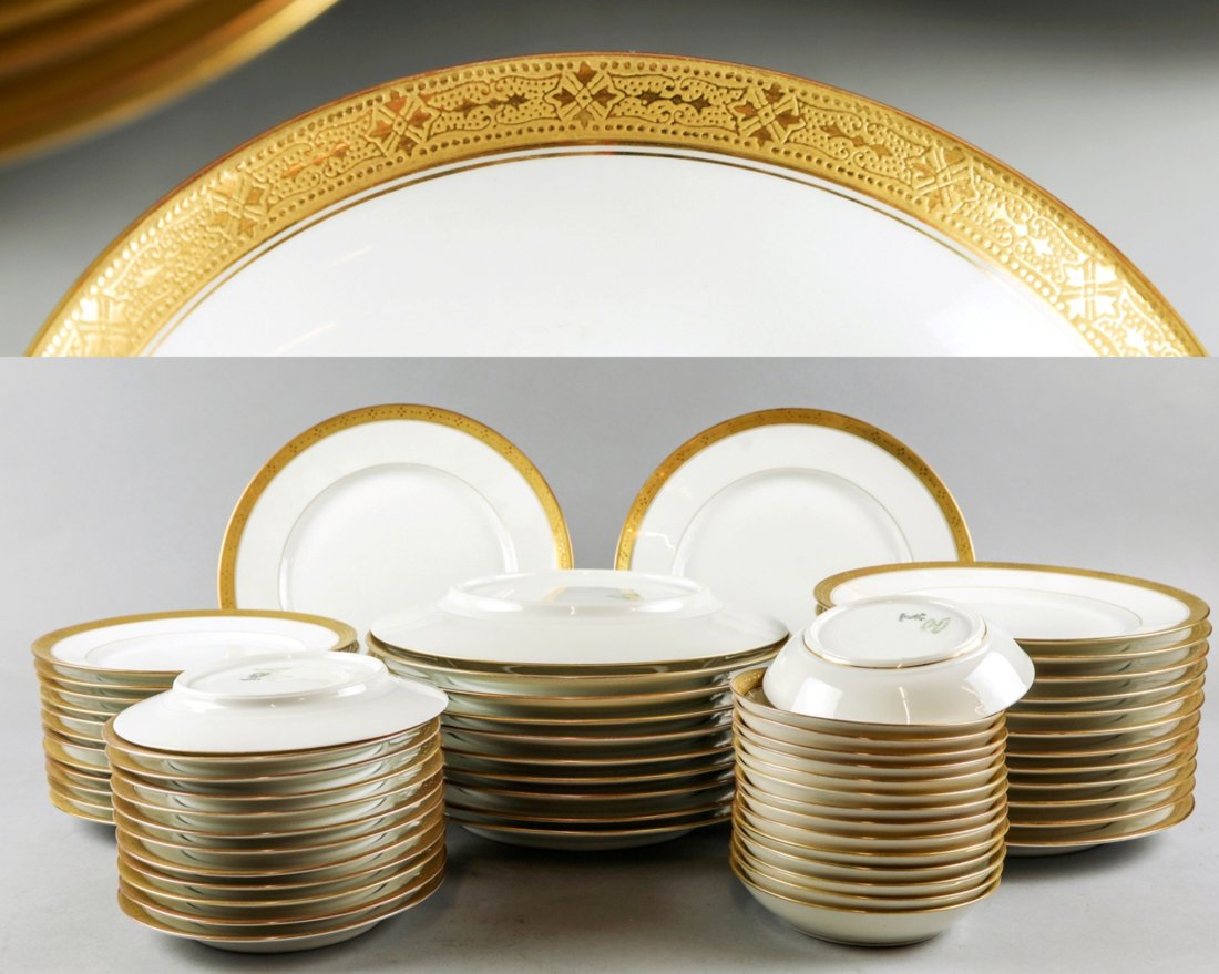 C. Ahrenfeldt Limoges for S&G Gump China Set: 59 pieces make of this stunning lot of Limoges china by C. Ahrendfeldt. These pieces were made for S & G Gump in San Francisco, Plate rims are encrusted in gold geometric shapes. Set includes 11 berry