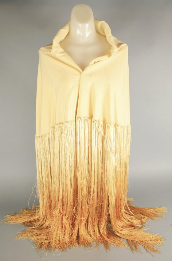 Antique Yellow Silk Oval Piano Shawl: Wonderful antique piano shawl in solid yellow silk with yellow to orange ombre fringe. Approx overall measurements approx 70" long with fringe fringe being 22" and body being 48". From the Estate of D