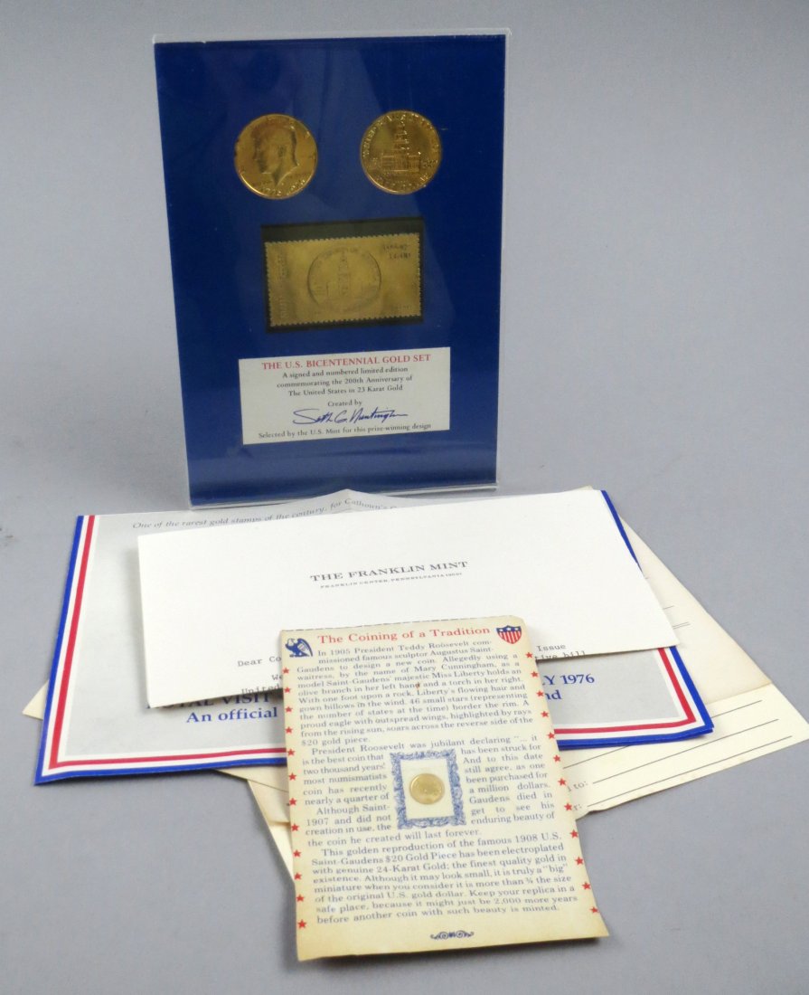 Lot of a Bicentennial Gold Set and a replica $20 gold P: Lot of a U.S. Bicentennial Gold Set, which consists of 2 23 Karat gold clad Kennedy Bicentennial Half Dollars, and a solid 23 Karat gold matching stamp in a lucite stand, with COA from the Calhoun Col