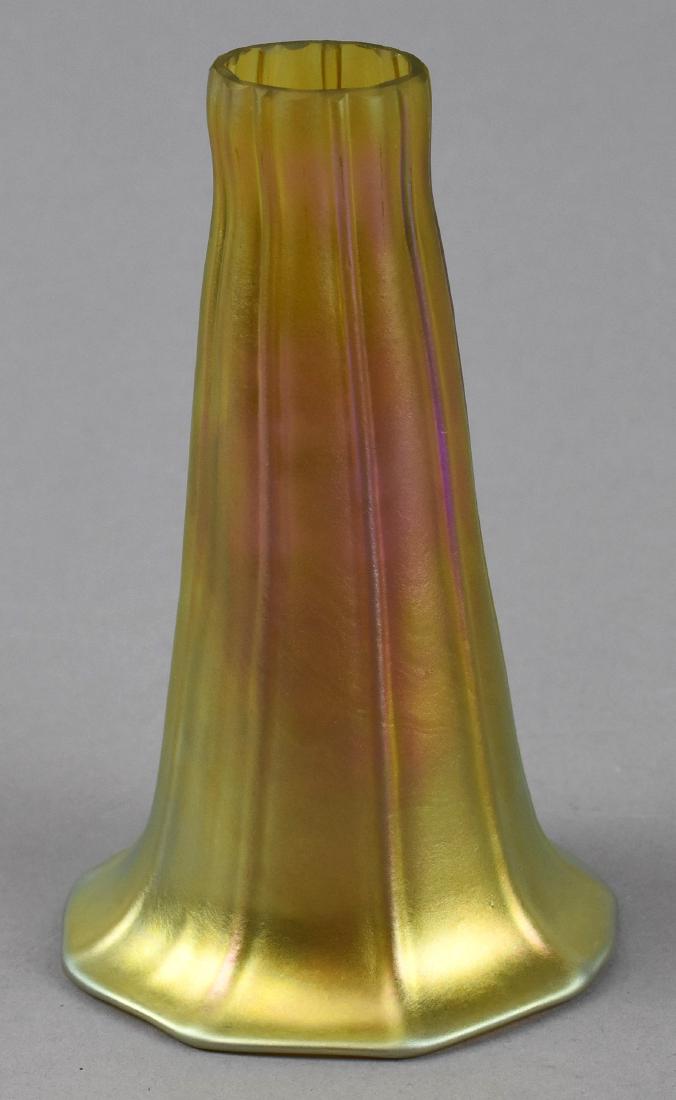 Iridescent Art Glass Lily Shade: Iridescent Art Glass Lily Shade. Appears in fine condition with no chips. Approx. 5 inch in height. Connector approx 1 inch. Outter rim 3 inches approx diameter with an opening of about 2.5 inches.