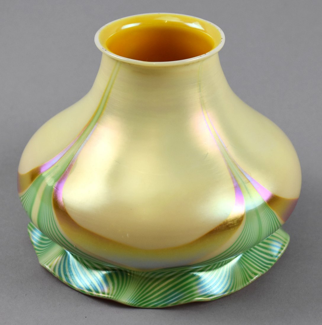 Attrib. Steuben Yellow & Green Pulled Feather Glass: Lovely yellow with green and gold pulled feather detail on this shade, attributed to Steuben. The interior shows gold with a pink iridescence. Approx measurements are 4" tall, 2" fitter, 5" outer rim.