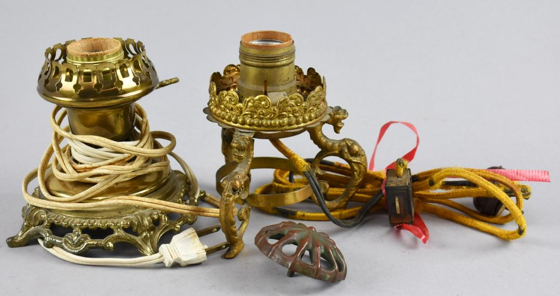Pair of Vintage & Antique Brass Lamp Bases: Nice little vintage and antique brass lamp bases. Vintage lamp is shiny brass with turn switch, stands approx 4 1/4" tall. Antique lamp patinated brass with leaf details and three dragon feet. Appears