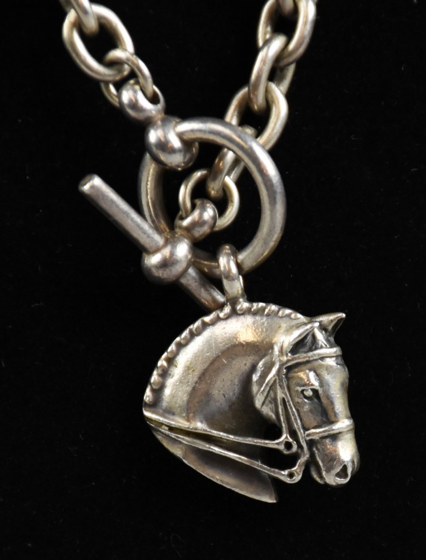 Sterling Jane Heart Horse Head Necklace: Very pretty sterling choker necklace with a heavy chain and bridled horse head pendant. Horse head is signed on the back Jane Heart and marked sterling. Measures approx 17" with an approx weight of 54