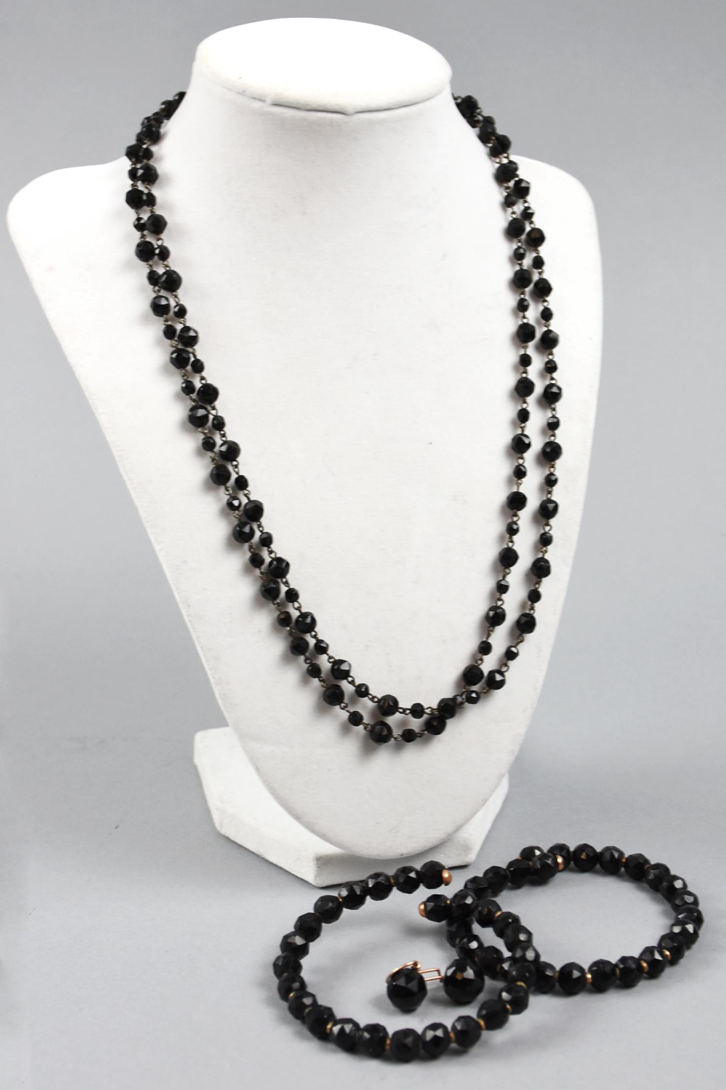 Victorian Jet Bead, Mourning Jewelry Lot: Nice lot of jet bead jewelry that includes two wire strung bracelets, one single strand necklace, one earring with gold filled hook and single bead, possibly the other earring in need of wire.