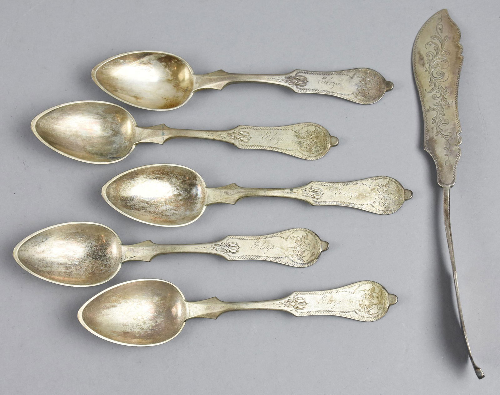 c1885 Duhme & Co Coin Silver Flatware: Lovely lot of sterling flatware from Duhme & Co. This is an unnamed pattern but can be found by looking for DUH8. Lot is of five spoons and a single knife. Each handle is monogrammed Eliza. Spoons app