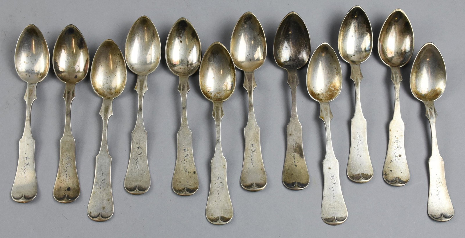 1885 Duhme Sterling, Augusta T. Dugan Spoons: Fantastic set of spoons in sterling silver by Duhme & Co. The pattern is called Tipped from 1885. These spoons have a cursive monogram of A. Dugan for Augusta T. Dugan. Each spoon weighs approx 19.89g