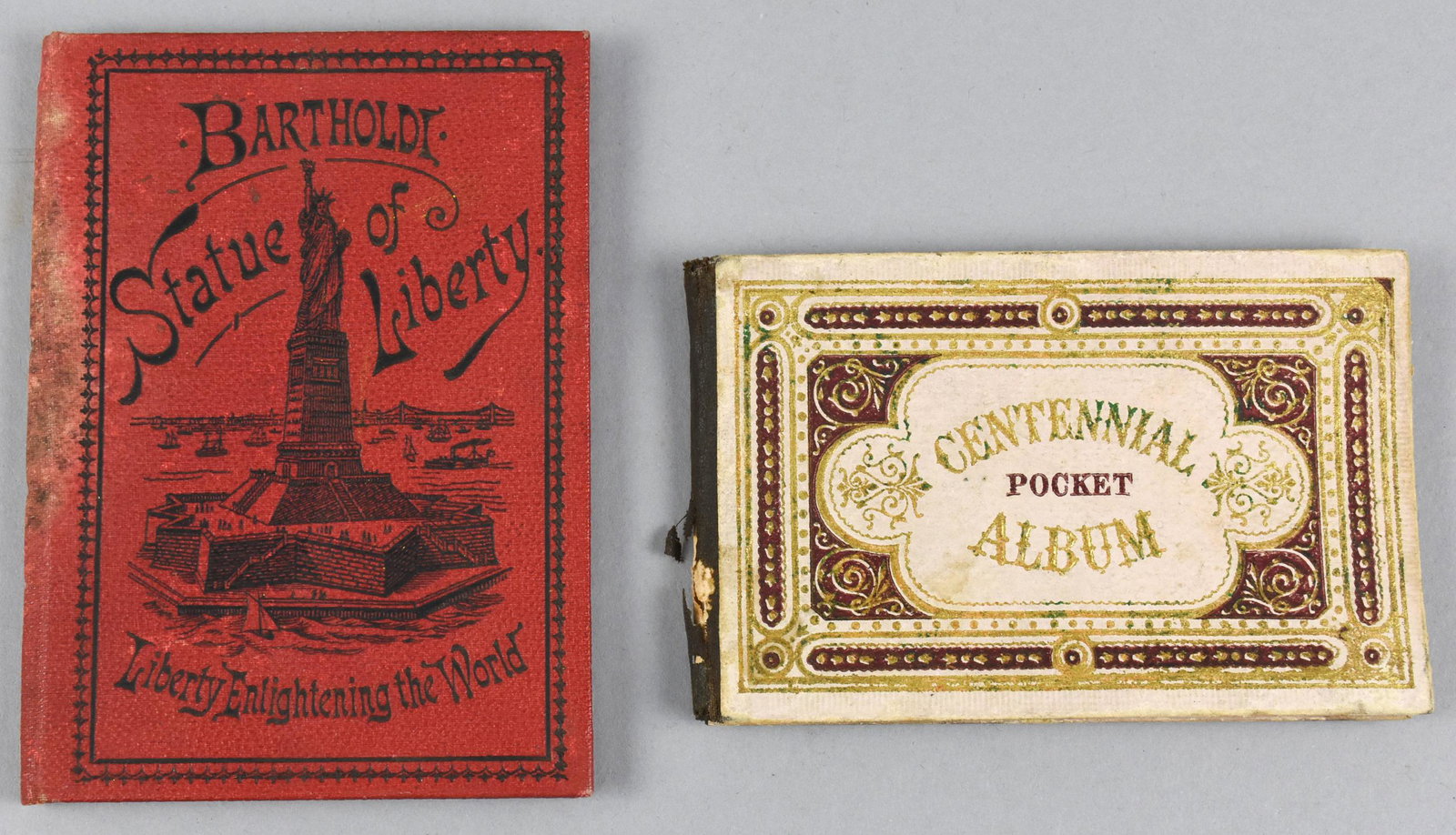 Lot of 2 books Centennial Pocket Album Bartholde: Lot of 2 small pocket books. One is the "Centennial Pocket Album" also "Bartholde Statue of Liberty". The Centennial Pocket Album is a collection of 14 pictures documenting the first 100 years of the 
