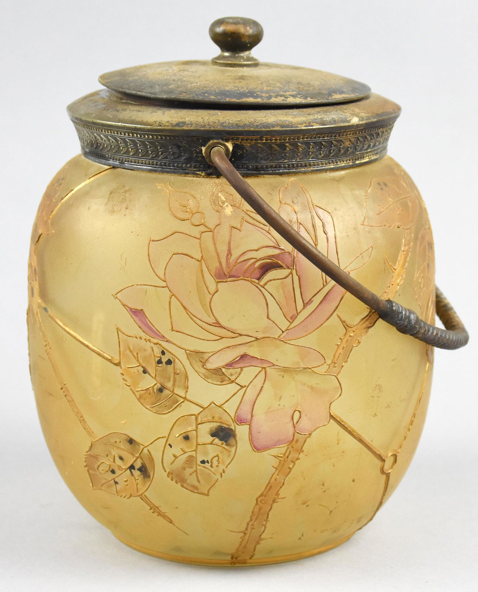 Mt. Washington Crown Milano Covered Glass Bisquit Jar: Antique piece of Mt. Washington Pairpoint "Crown Milano" bisquit jar with handle. Approx 7" tall x 5.5" wide. Old Mt. Washington mark on bottom in red. Inside lid is impressed "MW" with "4404 la".