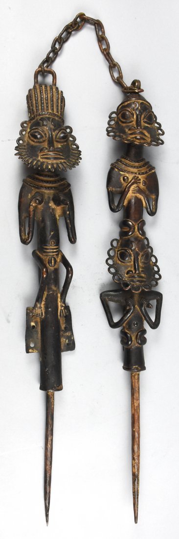 Ogboni Yoruba Nigeria: Cast pair of metal staff most likely depicting Edan & Ogboni. Appear to be of Ogbon Yoruba Nigeria origin. They are from the top of the head loupe to the tip of the spike approx 29 inches in length. H