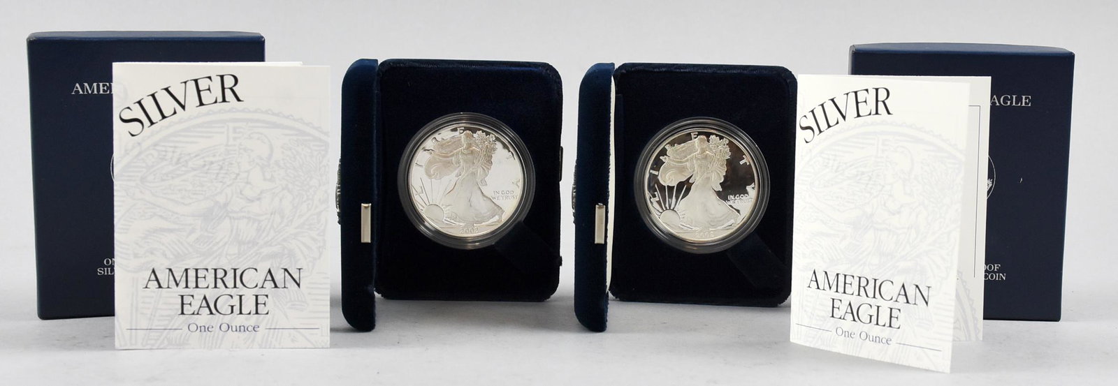 Lot of 2 One Ounce Proof Silver Bullion American Eagle: Lot of 2 2002 W Silver American Eagle coins. 1 ounce Proof silver bullion that has been encased by the United States Mint and housed in a velvet lined case and accompanied by a Certificate of Authenti