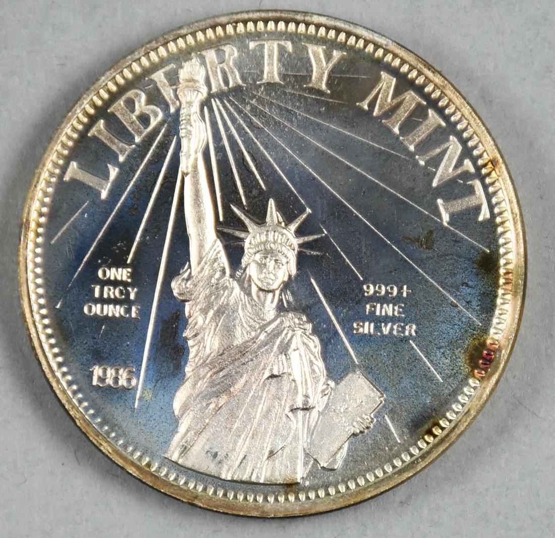 One Troy Ounce, Silver Round: Lot of a one troy ounce, .999 Fine Silver round, Dated 1986 by the Liberty Mint. On the obverse shows the Statue of Liberty. On the reverse has the quote from Article 1, Section 10 of the uS Constitut