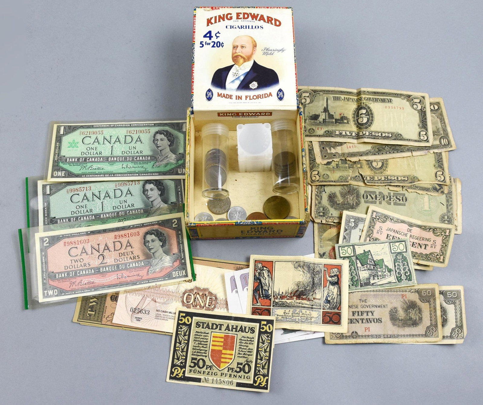 Lot of World Coins and World Paper Money: This lot contains various world coins and different world paper money. The coins are from Canada, Korea, Argentina, China, Japan, England and Italy. The paper money contains bills from Korea, Japan, G