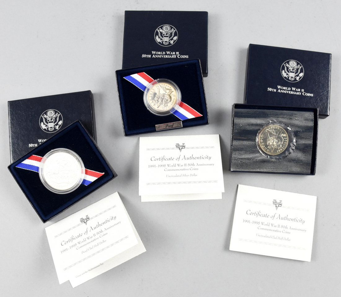 Lot of 3 WWII 50th Anniversary Coins: This is a lot of 3 individually packaged World War II Commemorative coins. The first is an Uncirculated silver dollar that shows the Allied Troops storming the Beaches of Normandy on the obverse, and