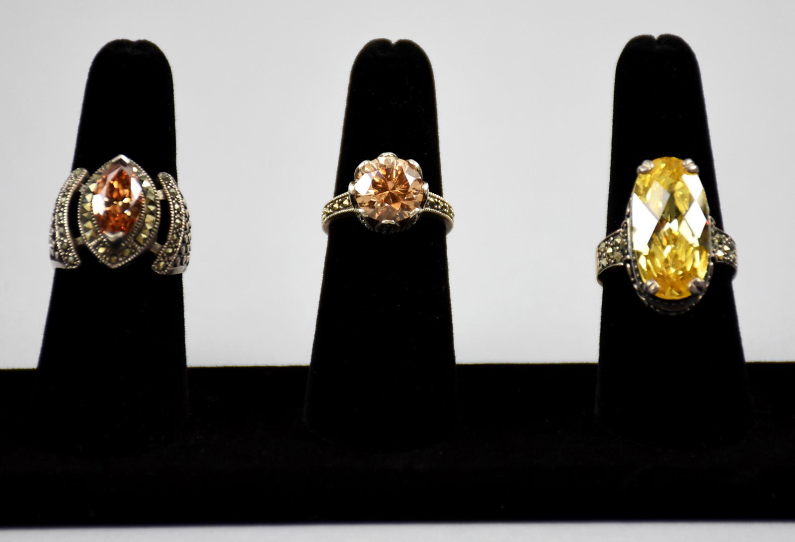 Beautiful Hava Sterling Ring Lot: This lot of rings is a lot of fun and wearer will enjoy compliments all day. These sterling rings by Hava consist of one faceted oval citrine colored crystal with a small marcasites. Stamped 8, tests 