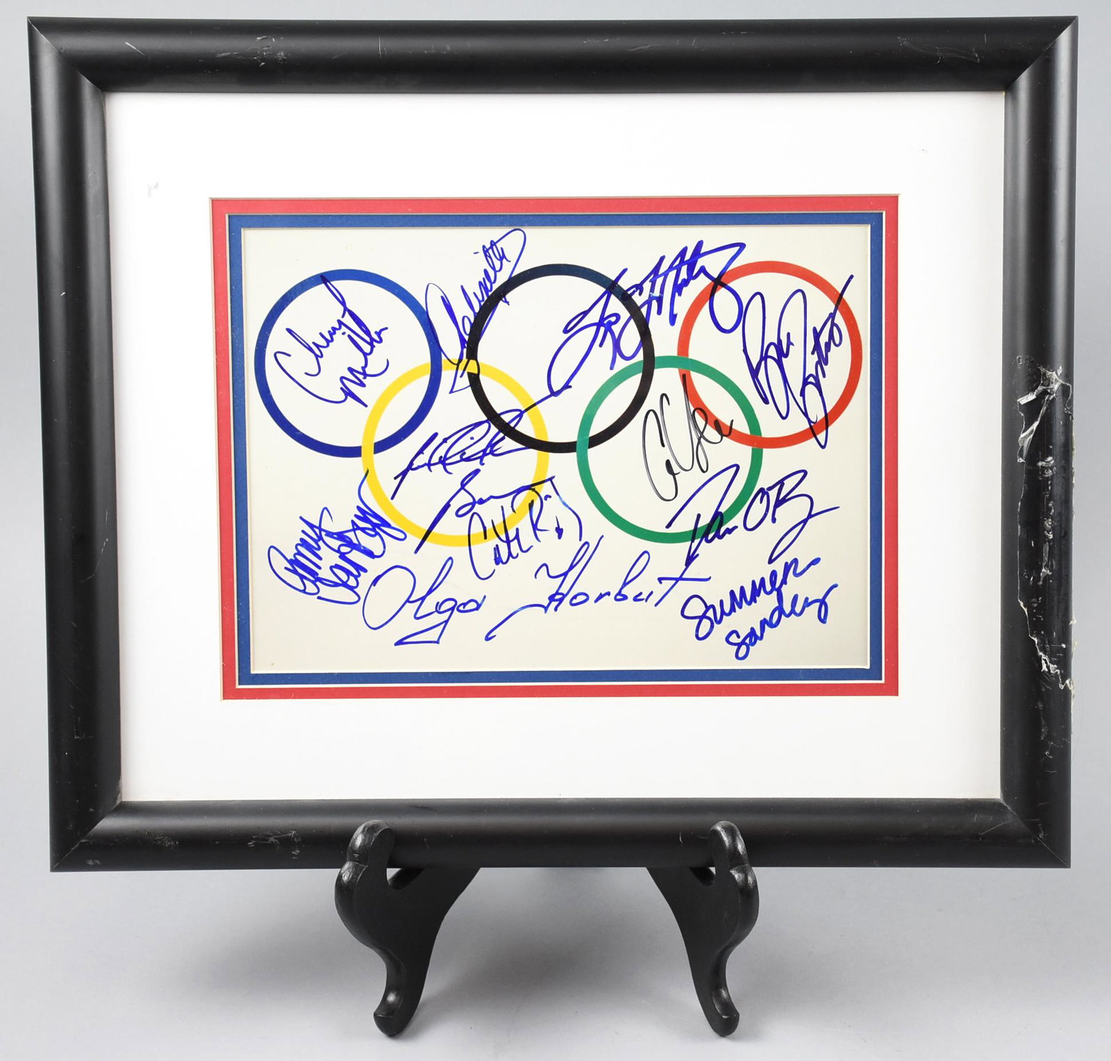Olympics Rings Multi Signed Photograph, PSA: This great Olympics rings print has been signed by athletes that have participated in the Olympic games. A few of the names include Olga Korbut, Summer Sanders and Cheryl Miller. Riddick Bo, Brian Boi