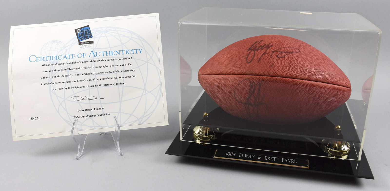 Dual Signed HOF Footballers, John Elway/Brett Favre w/: This nice football was signed by two greats, Brett Favre of Green Bay Packers fame and John Elway of Denver Broncos fame. This Wilson ball has a special lucite and wood display case with the two playe