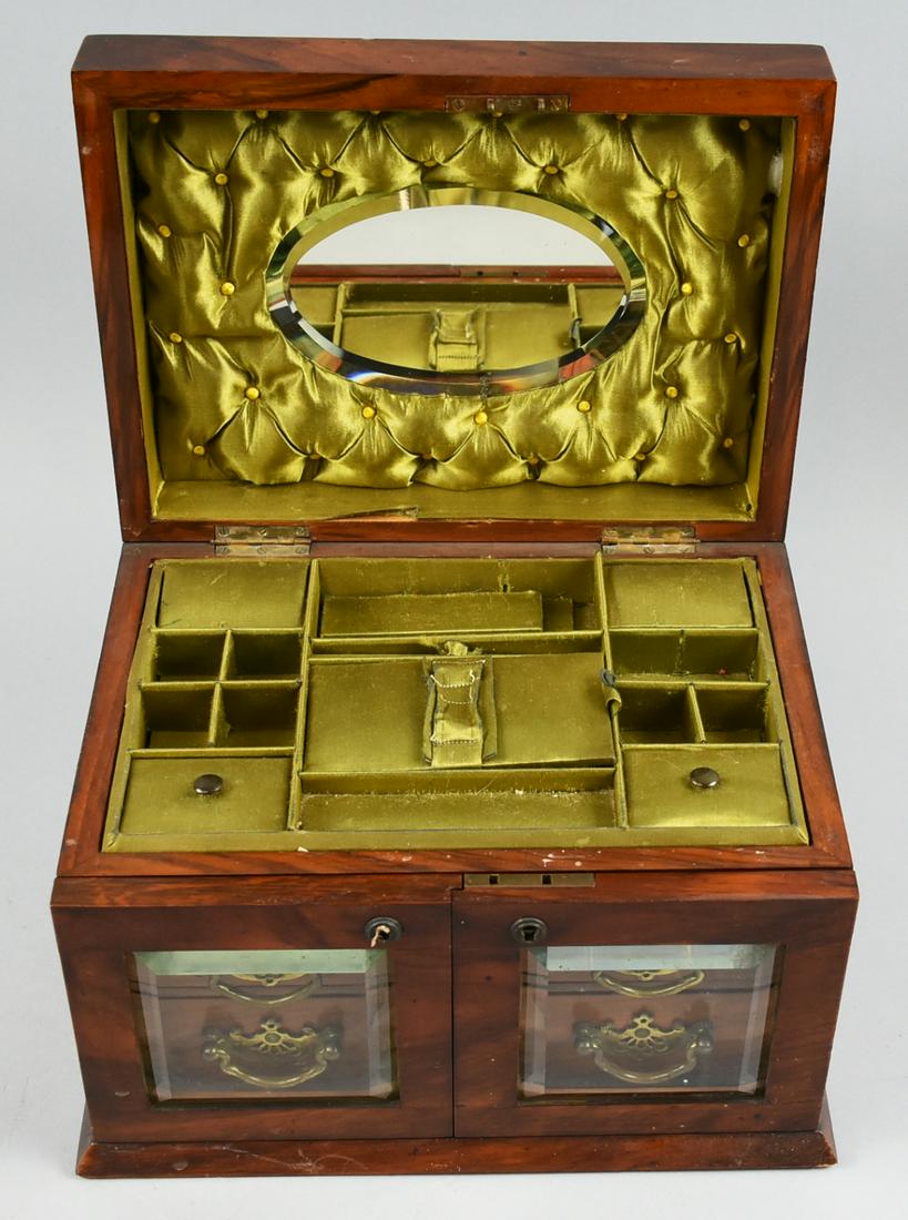 Antique Victorian Solid Wood Satin Lined Jewelry Box: This is an amazing piece with beveled glass fronts and bevel glass mirror on the inside.Beautiful tiffed satin sil on the inside. Box closures fit very well. Satin is in very good condition. Box is ab