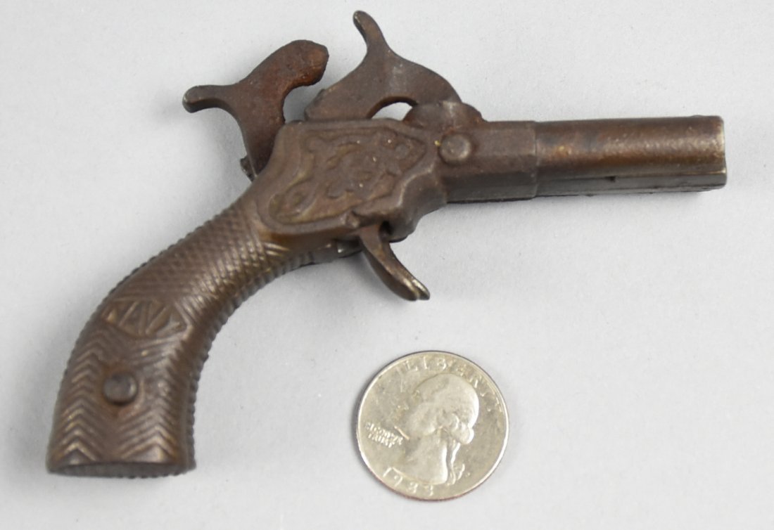 Rare 1878 J&E Stevens Navy Double Barrel Cap Gun: Great looking J&E Stevens Navy cap gun from 1878. This rare toy is double barrel in cast iron and marked NAVY on both sides. The hammers cock and triggers work, they are a little loose when not cocked