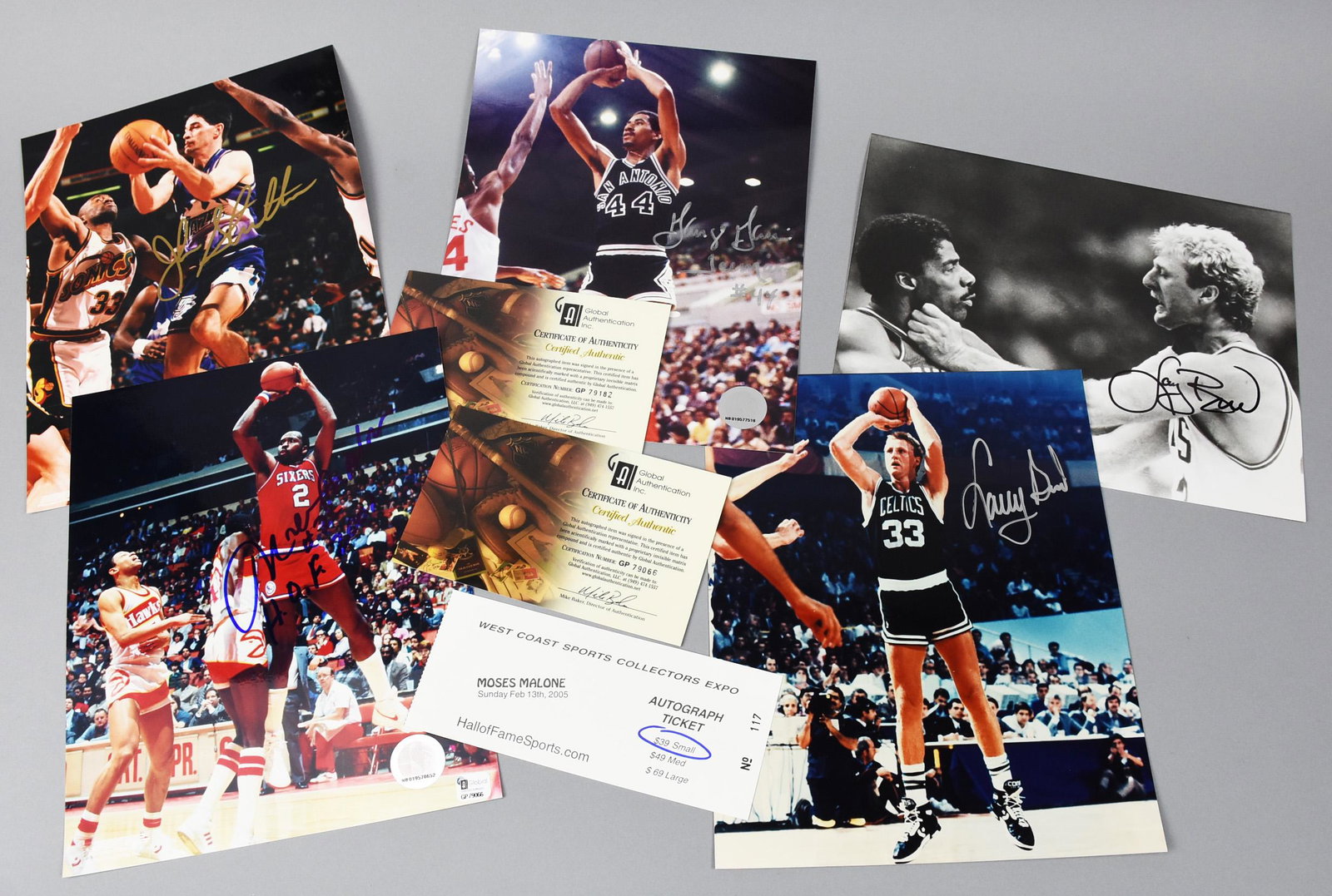 Various NBA Player Signed Photos, Stockton, Bird COA: These are a nice group of basketball player signed photos. John Stockton from the Jazz; Moses Malone from the Sixers with COA from Global Authentication with coordinating numbers on the photo, and a t
