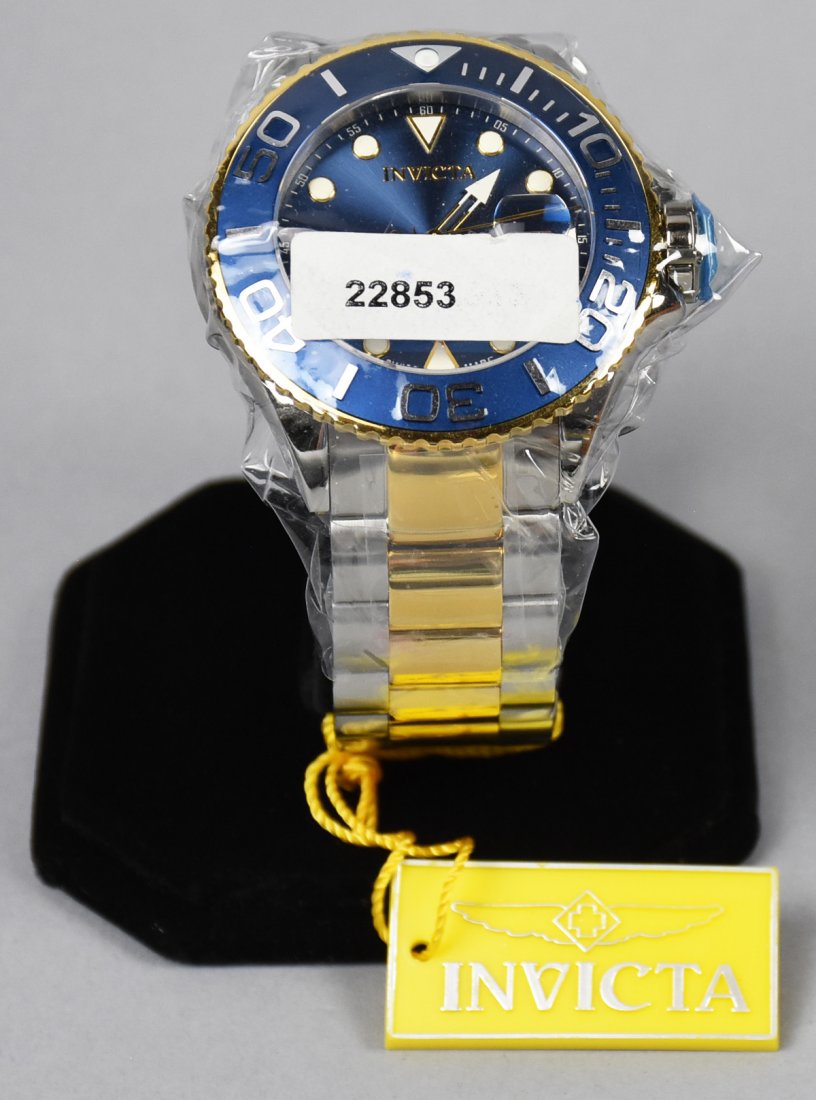 Invicta Grand Diver, No. 22853: Unused and still in original factory wrap and original tags. Silver and gold accent stainless band.