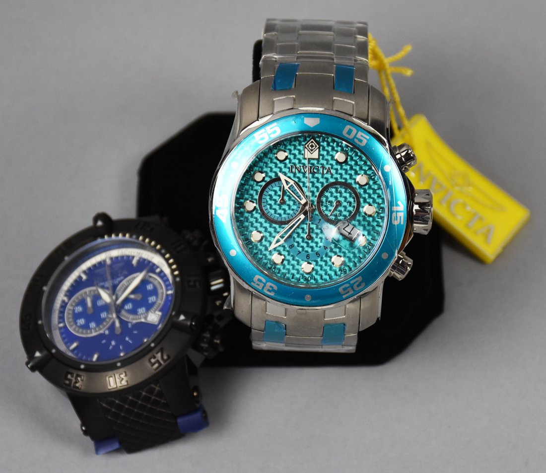 PAIR Invicta Subaqua 5509/ Pro Diver 18606: This pair of Invicta watches appear to be unworn. Subaqua, model no. 5509 needs a new dark blue rubber band. Pro Diver, model no. 18606, comes with original factory protective wrap and factory tag.