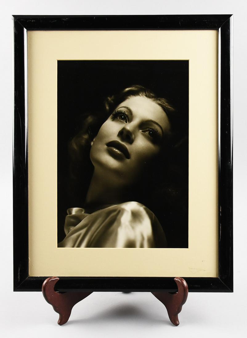 Large B&W Ava Gardner Photo Hurrell Style: What a stunner Ms Ava Gardner was. Here she is looking amazing, staring upwards. Matted and preserved, this framed piece measures approx 18 1/2" x 15" In the style of George Hurrell.