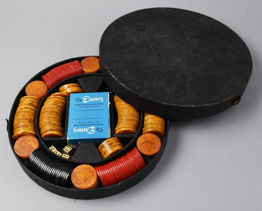 Vintage Poker Chip Set, Dunes Las Vegas Cards: Cool vintage poker chip set comes in a nice round case and includes red, orange and black bakelite chips, two decks of cards, one from The Dunes in Las Vegas, although the box is ripped, it does not a