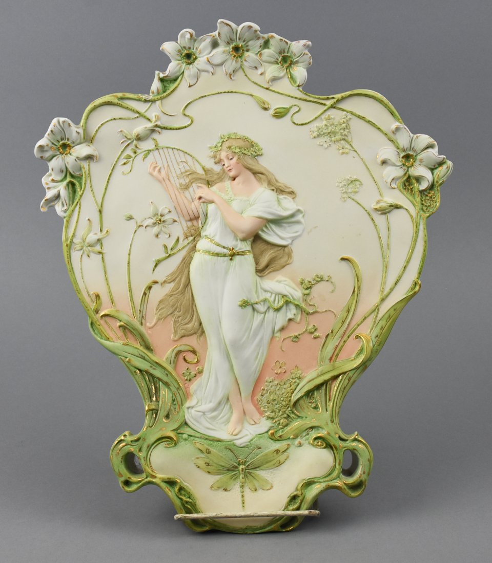 Volkstedter Bisque Harp Playing Woman Plaque: This gorgeous piece is Art Nouveau in style depicting a long haired woman playing a harp. The back has a blue mark that looks like a flower with a line through it and has been identified by the owner.