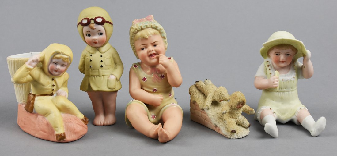 Antique Lot, Baby Bisque Figurines, German, Nippon: These little cuties are both of German and Japan origin. The only one that appears to be Nippon is the little Kewpie style aviator and is also the tallest of the lot standing approx 4 1/8". Inluded ar
