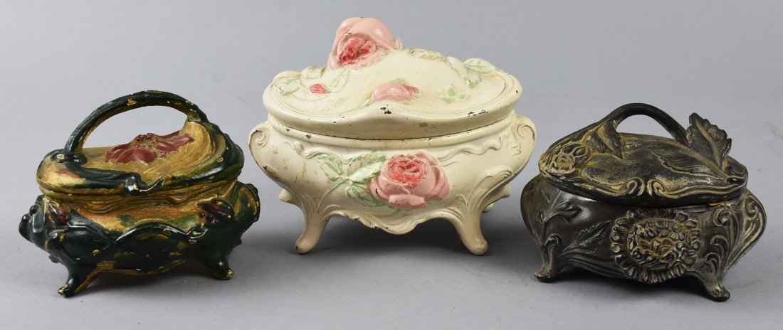 3Pc Lot, Art Nouveau Painted Casket Jewelry Boxes: Gorgeous painted Art Nouveau jewelry box caskets, one having a clear maker mark of NB Rogers and one being identified by number only, 122. The largest is the white with pink flowers, no maker or numbe
