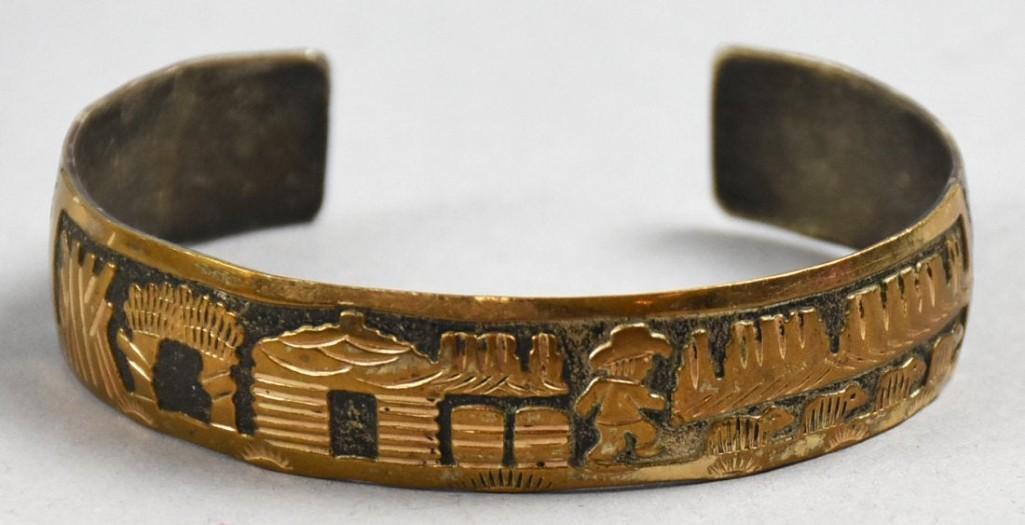 VTG Gary Edwards Navajo Sterling Storyteller Bracelet: Interesting and pretty sterling silver bracelet from Native American jewelry artist Gary Edwards. It is a storyteller bracelet depicting a man near a cabin and animals. The scene is sterling with a go