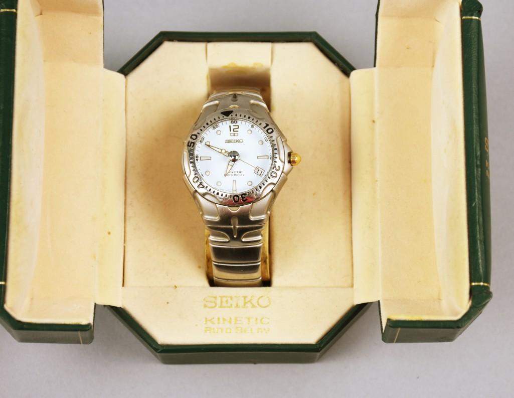 Like New Seiko Kinetic Auto Relay Watch: This great watch appears to have never been worn as it still retains the protective plastic to the back of the case. Still in original box and retaining all original paperwork.