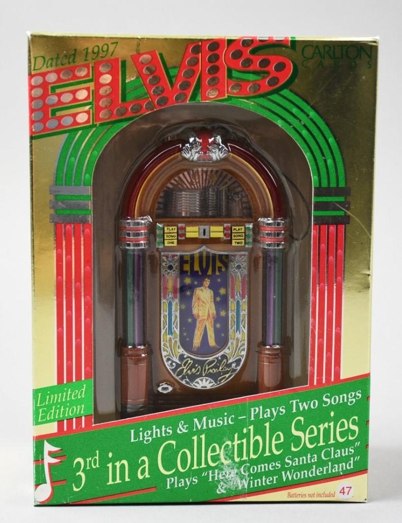Elvis Jukebox Ornament NIB: Elvis jukebox ornament that lights and plays two songs, came from Carlton Cards in 1997. In original box, appears in very good to excellent overall condition.