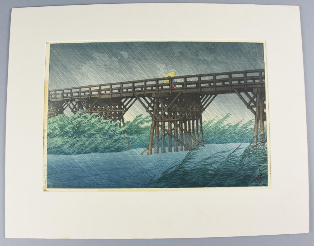Hasui Kawase (1883-1957) Woodblock Print: Very pretty woodblock print titled "Evening shower at Imai Bridge" is from Hasui Kawase and is very well marked. Comes with matte that is very clean. Image measures approx 10 1/4" x 15 1/2".