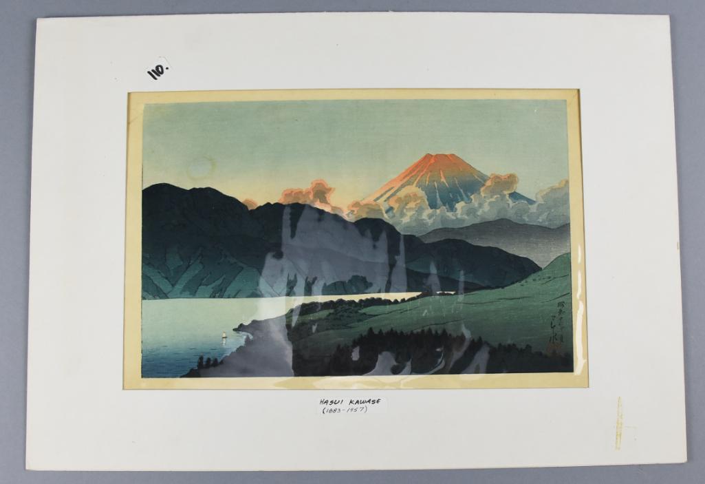 Kawase Hasui (1883-1957) Woodblock Print: A Nocturnal Fuji: Lake Ashino is a woodblock print from Kawase Hasui from 1935, published by Watanabe. Features rich blues with orange accents. Comes in a simple matte with identification sticker