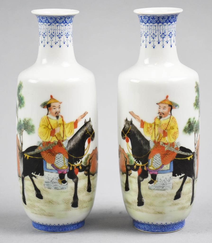 Pair Mid 20th C Qianlong Nian Zhi Vases: Very cool vases from the mid 20th century have the Qianlong Nian Zhi mark on the bottom, Made in Qianlong. They are mirror opposites of one another, riding a black horse and handing off an article.�