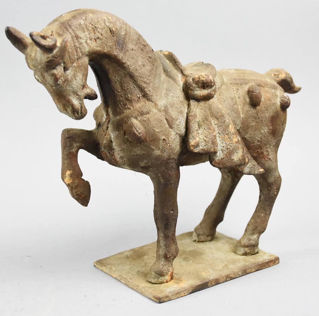 Antique Japan Cast Metal Horse: This is a wonderful cast metal prancing horse sculpture with saddle, head down. Horse is attached to a metal base, stamped with JAPAN. Size is approx. 10" x 12"