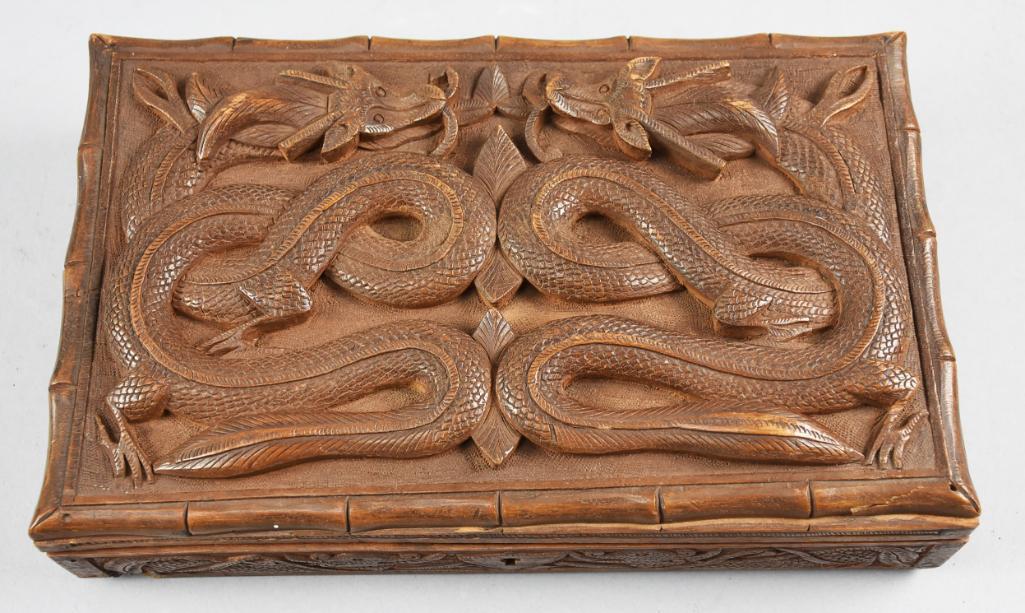 Chinese Double Carved Dragon Wood Box: Chinese double carved dragon wood box. Has a lock, do not have the key. In very good condition, a few minor chips. All hand caved. 2.5 x 11 x 7.5 inches. Box is hinged and fits securely.