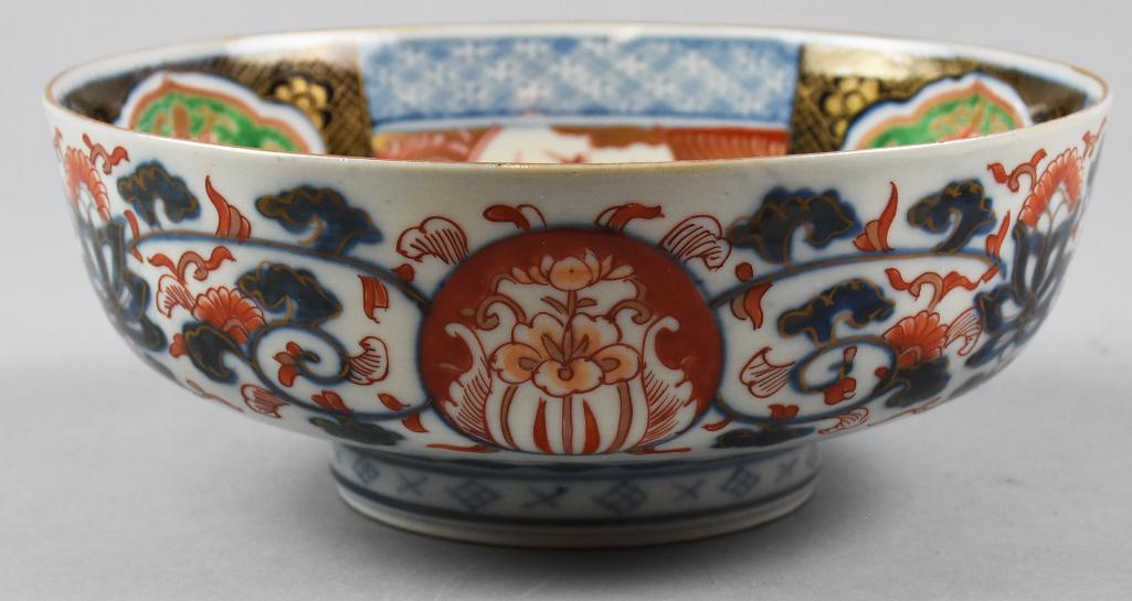 Antique Japanese Imari Hand Painted Bowl: Antique Japanese Imari-style hand-painted porcelain bowl, with overall floral and geometric designs and gilt highlights. Approx. 3" tall and 8.5" around. Unsigned. Has label that states, "Over 150 yea
