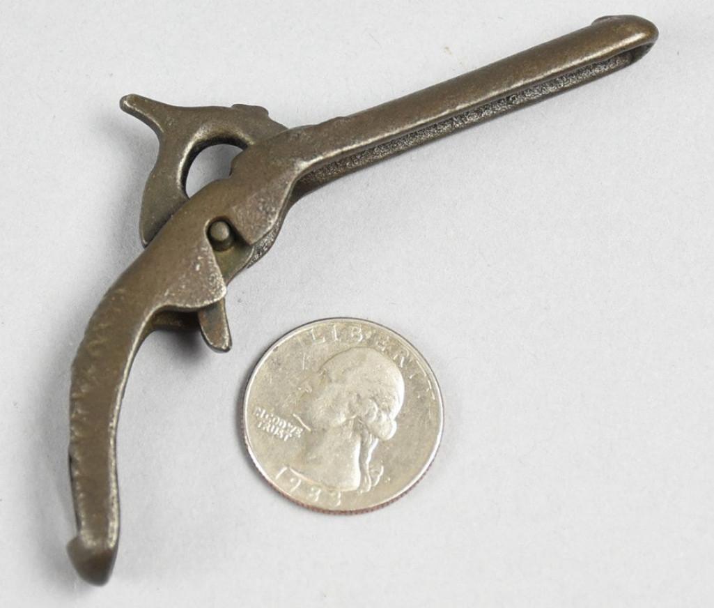 Antique Ideal Gem Penny Pistol Cap Gun: Small and unmarked, it appears to be an Ideal Gem penny pistol toy cap gun. It's small shape is solid on top, open on the bottom, showing how it functions. Hammer cocks and trigger w